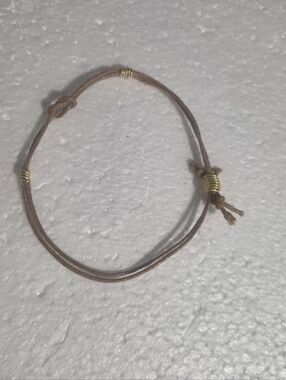 Handcrafted Adjustable Brown Leather Cord Bracelet with Gold Accent